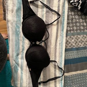 Black lace bra with crossover front strap